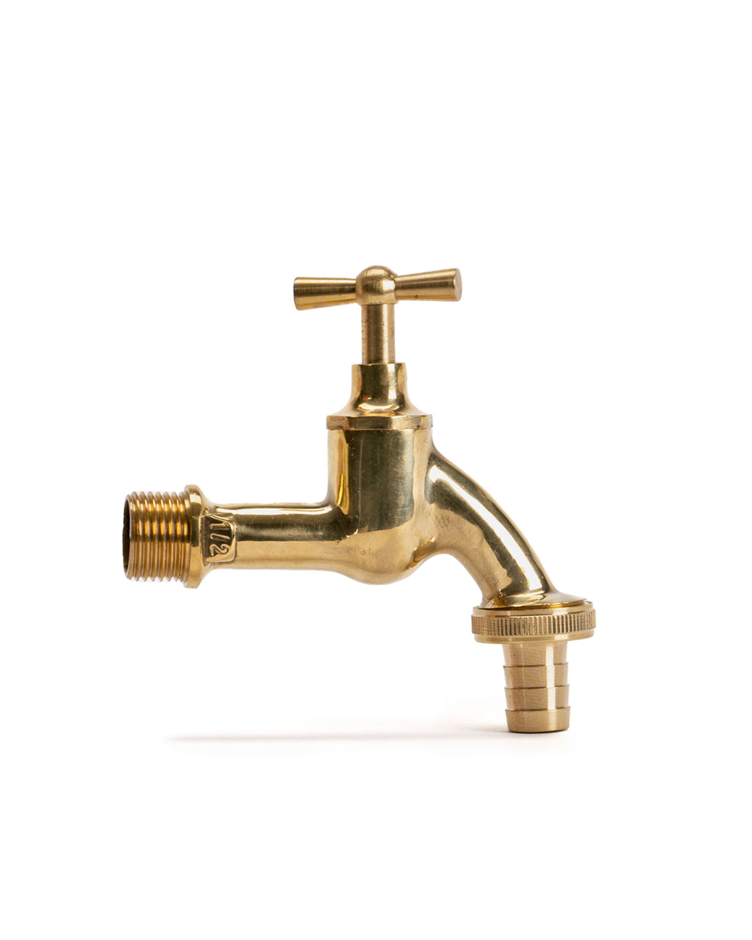 a brass faucet with a white background