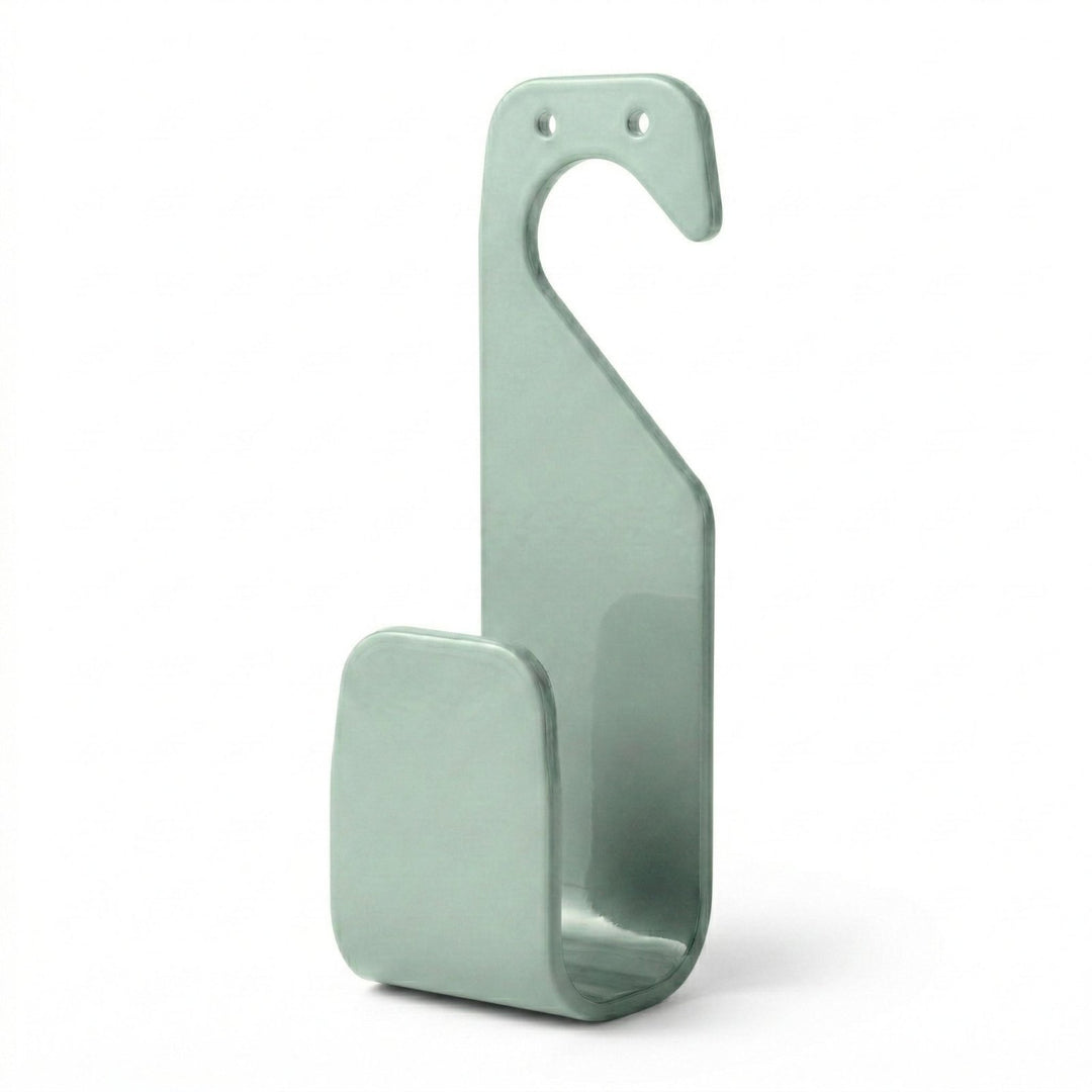 Hellgrüner Schlauchhalter ohne Bohren von LIVLIG, mit zwei Bohrlöchern oben und abgerundeten Kanten.
